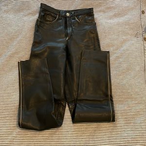 Black heavy duty leather pants - with off white pinstripes on seams and pockets.